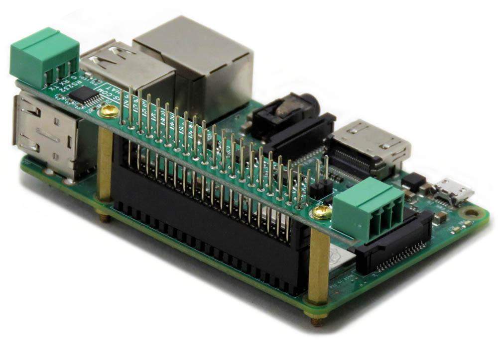 Two Serial Ports RS485 and RS232 stackable HAT mounted on Raspberry Pi GPIO pins with green pluggable connectors and status LEDs.