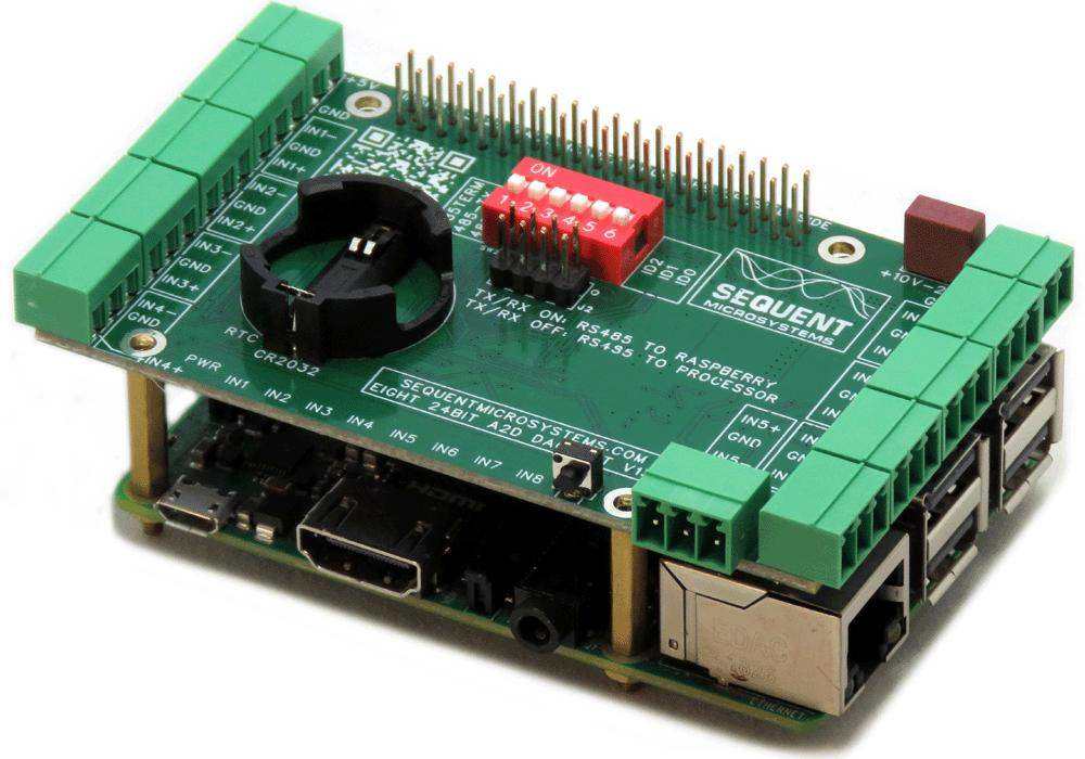 Eight 24-Bit Analog Inputs DAQ 8-Layer Stackable HAT mounted on Raspberry Pi with green terminal blocks and red DIP switch.