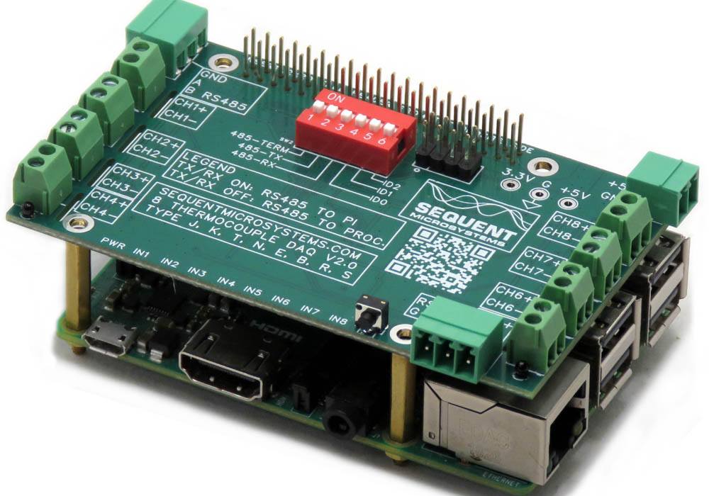 Eight Thermocouples DAQ 8-Layer Stackable HAT module mounted on Raspberry Pi board with green terminal blocks and red DIP switch