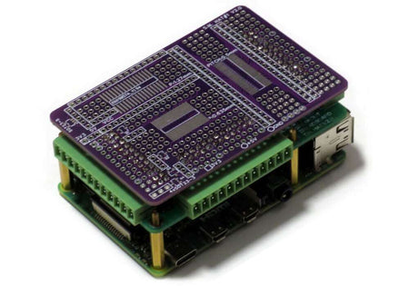 Breakout card kit with pluggable terminal blocks and breadboard prototype areas for Raspberry Pi GPIO pins.