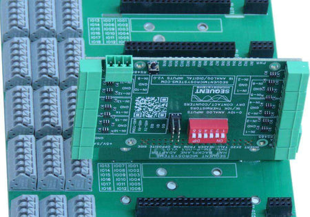 Back Panel for Raspberry Pi with green circuit boards, gray terminal blocks, black headers, and red DIP switches