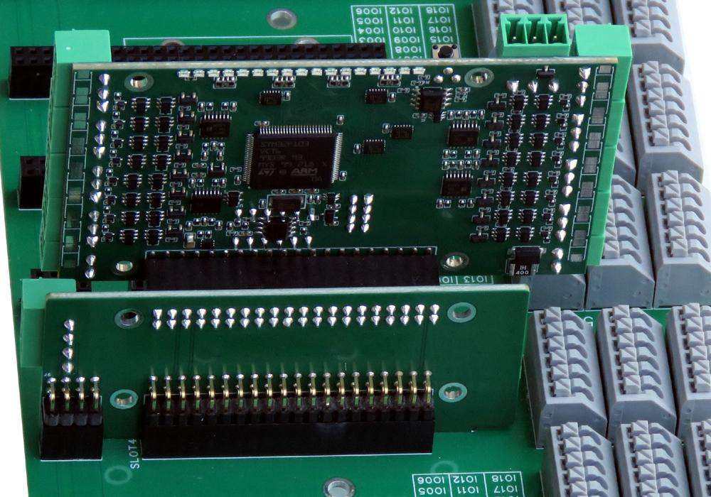 Back Panel for Raspberry Pi with green circuit boards, black components, and rows of gray terminal blocks