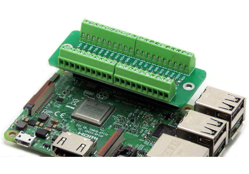 Breakout Card Screw Mount with green screw terminals and circuit board mounted on a Raspberry Pi GPIO header