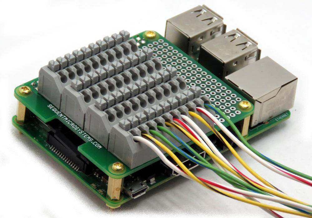 Breakout Card Type2 green Raspberry Pi GPIO board with gray spring terminals, multicolored wires and brass standoffs