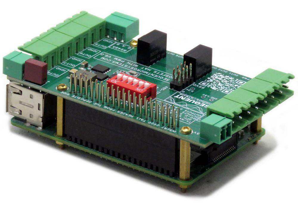 Eight MOSFETS Raspberry Pi HAT with a green circuit board, pluggable terminal blocks, red DIP switches and black components