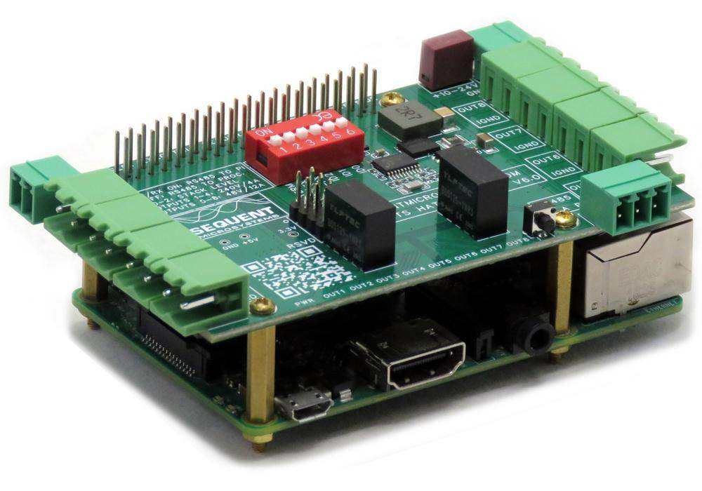Eight MOSFETS Raspberry Pi HAT with a green circuit board, green terminal blocks, red DIP switch, and brass standoffs