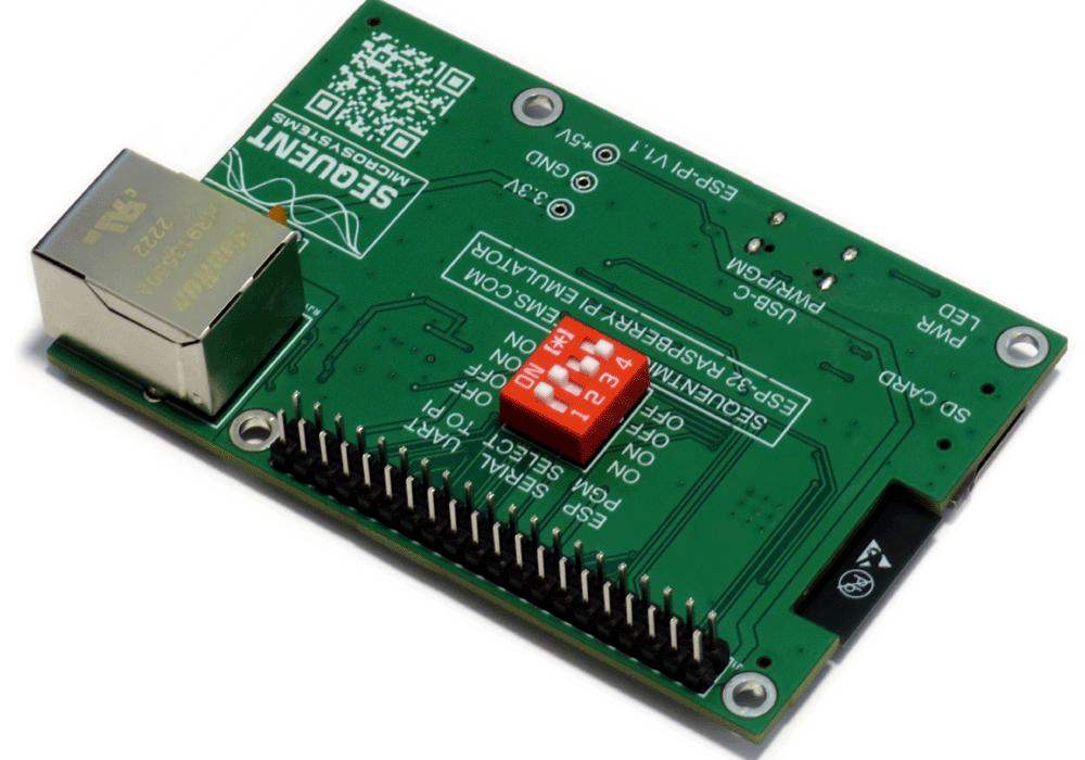 ESP32 development board with a green circuit board, silver Ethernet port, black GPIO header and red DIP switch