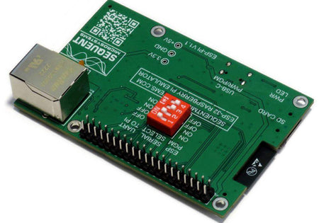 ESP32 development board with a green circuit board, silver Ethernet port, black GPIO header and red DIP switch