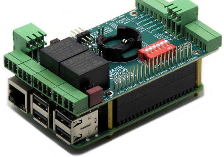 Multi-IO HAT with a green circuit board, black relays, green screw terminals, and red DIP switches stacked on a Raspberry Pi