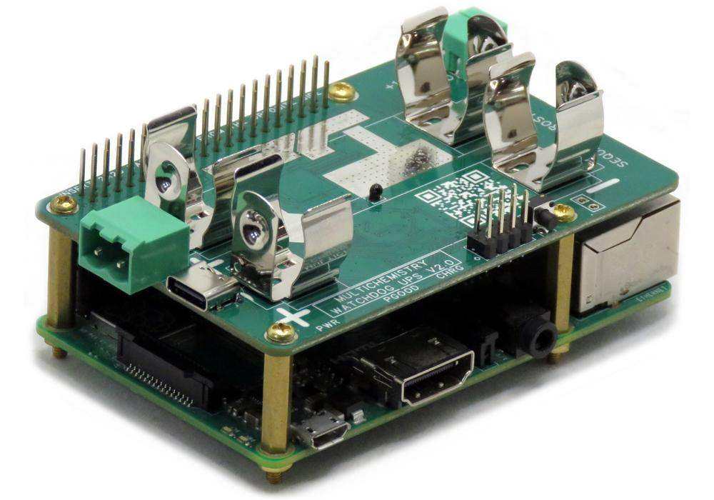 Multichemistry Watchdog HAT, a green circuit board with metal 18650 battery clips, mounted on a Raspberry Pi