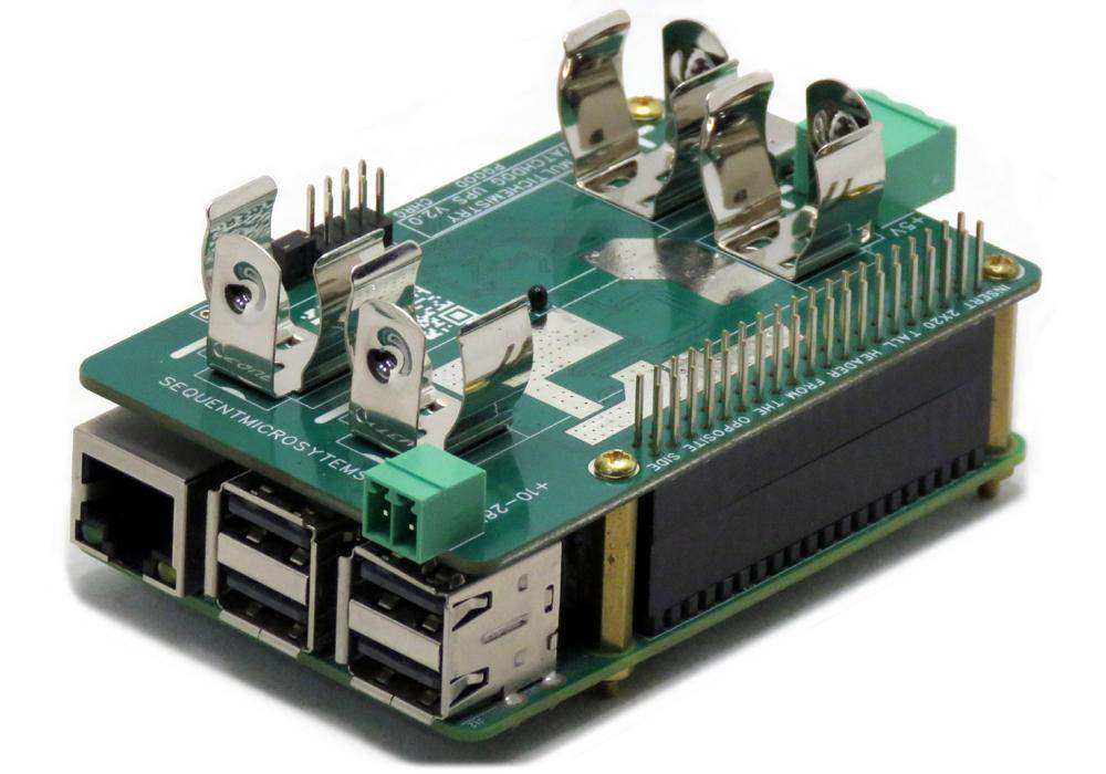 Multichemistry Watchdog HAT, a green circuit board with metal 18650 battery holders, stacked on a Raspberry Pi