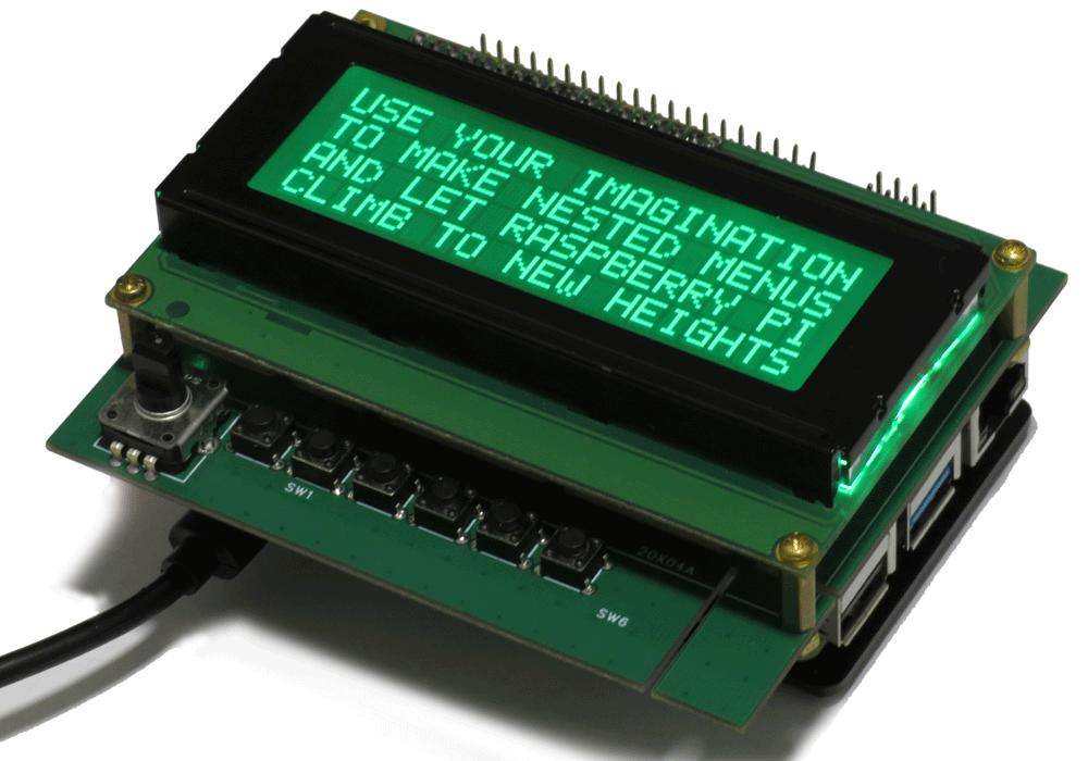 Six-in-one LCD Adapter with a green circuit board, black-framed LCD showing turquoise text, rotary encoder and buttons
