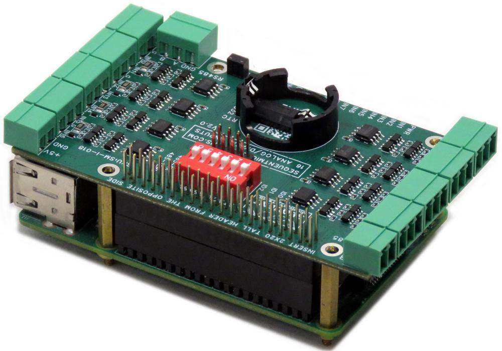 Sixteen Analog-Digital Inputs card with a green circuit board, pluggable terminal blocks, red DIP switches, and battery holder