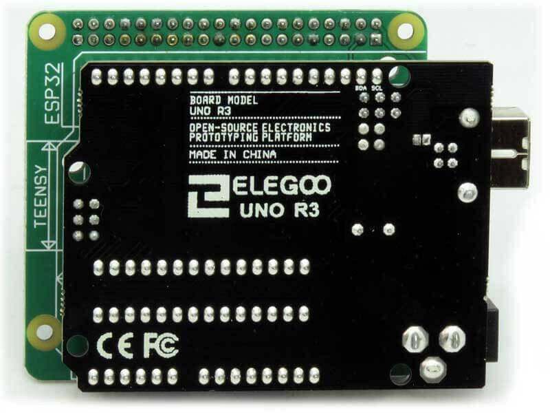 Arduino Uno replacement adapter board with a green PCB and black Elegoo UNO R3 board, pin headers and USB port