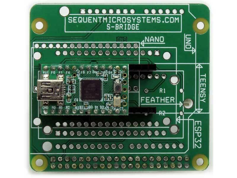 Arduino Uno Raspberry Pi replacement adapter board, green PCB with white socket labels and a small module installed