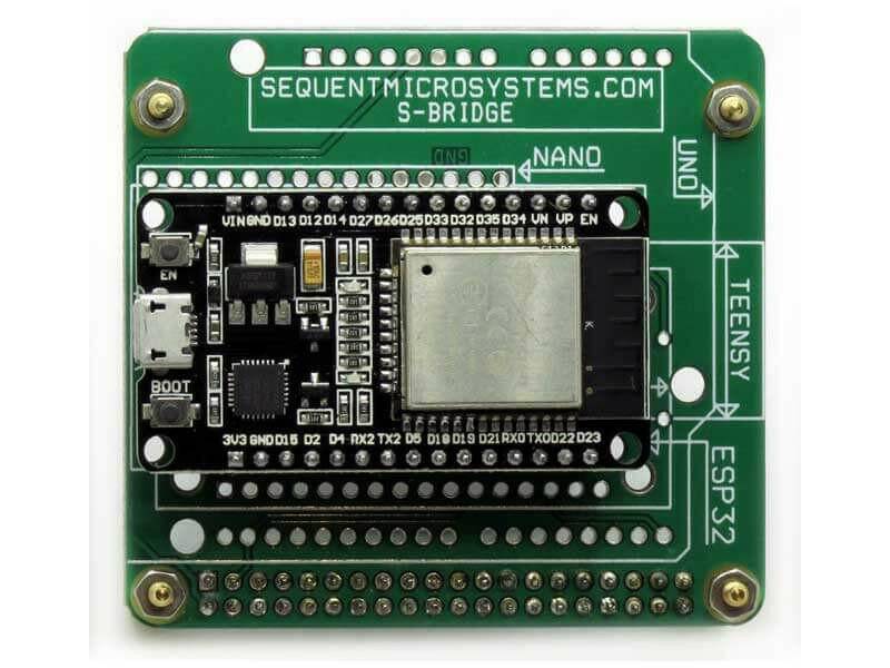 Arduino Uno-compatible green Raspberry Pi replacement adapter with an ESP32 module, gold mounting holes and pin headers