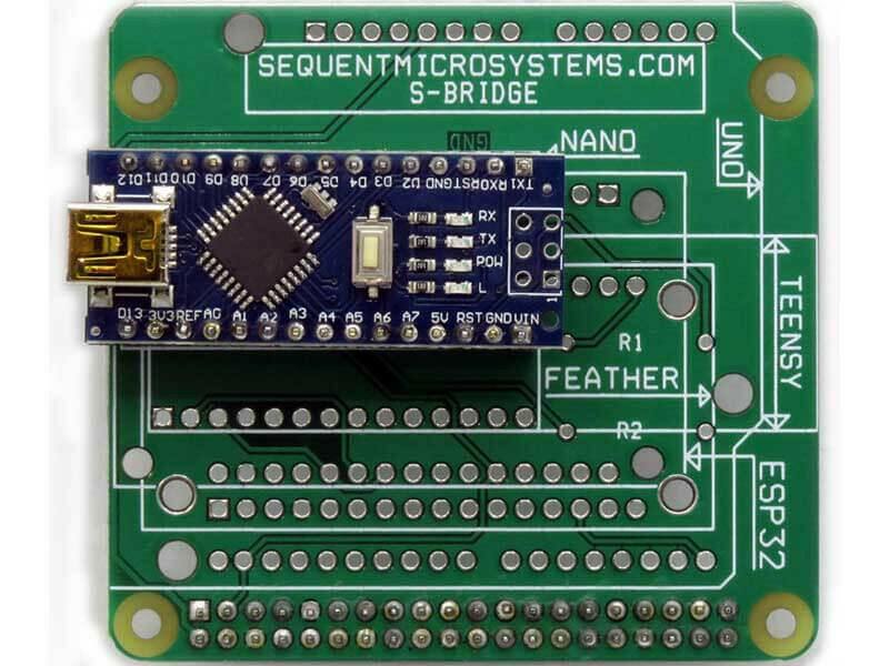 Arduino Uno replacement adapter board with green circuit board, white processor socket labels, and a blue microcontroller