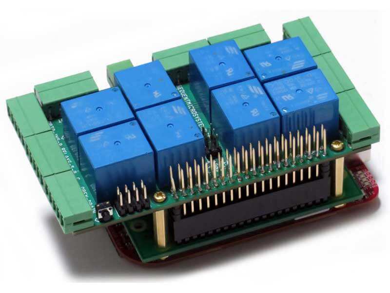 Beagle-Pi circuit board with blue relays, green screw terminals, and rows of gold GPIO pins