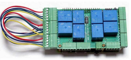 Home Automation self-test cable with multicoloured wires attached to a green circuit board with blue relays