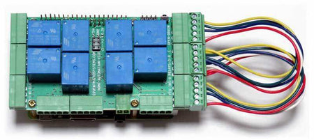 Home Automation self-test cable with multicoloured wires and green connectors attached to a green circuit board with blue relays